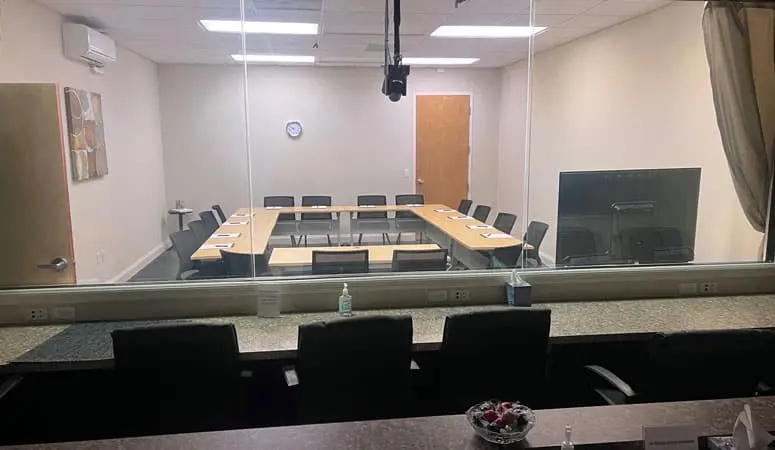 Client observation room behind the one-way glass
