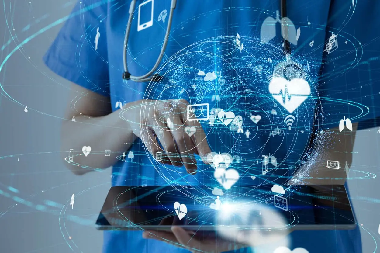 Healthcare professional reviewing connected clinical data