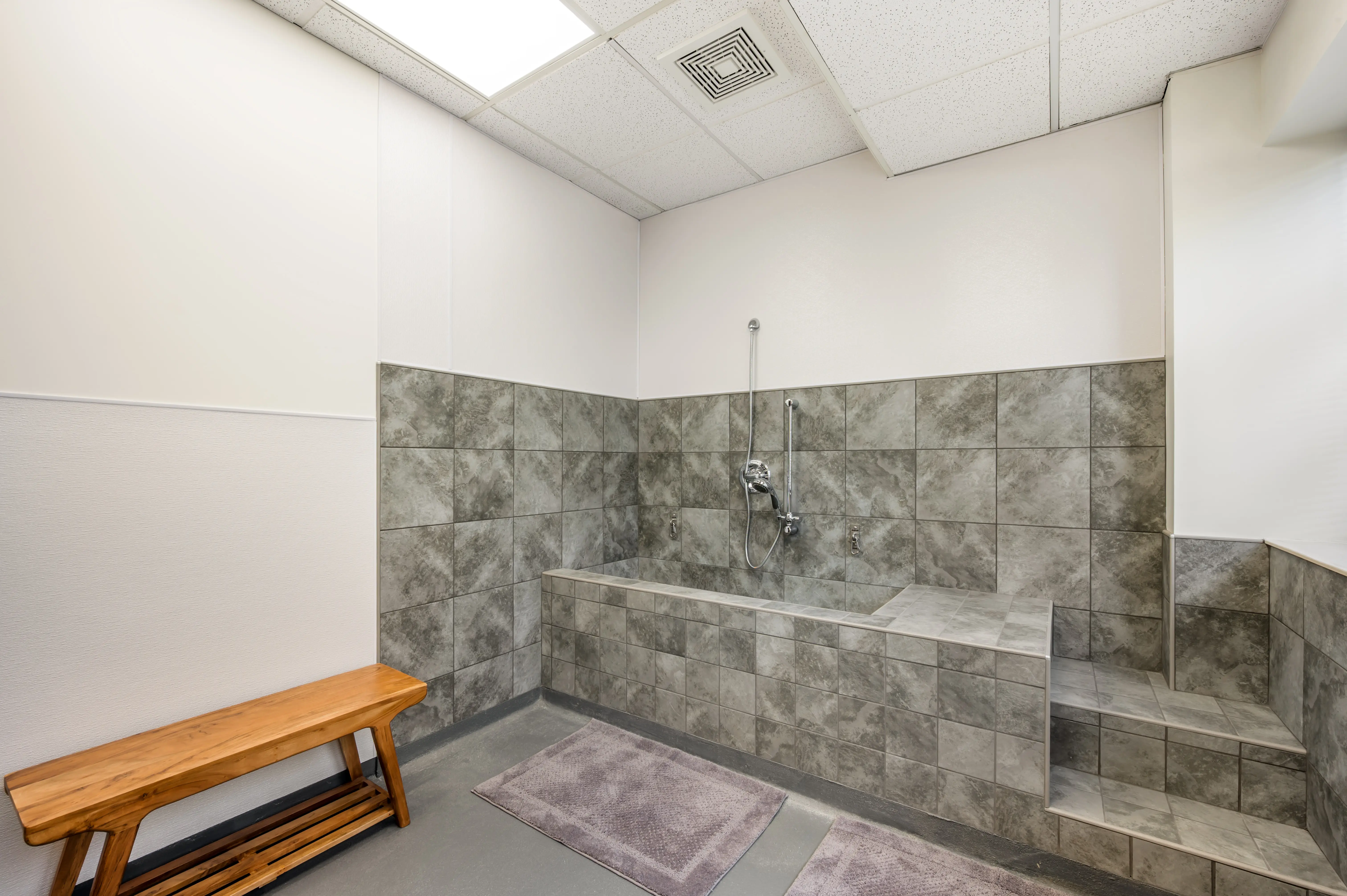 Water-safe HydroSafe research hub with tiled wash station for pet care and fluid-based product testing at L&E Research Cincinnati