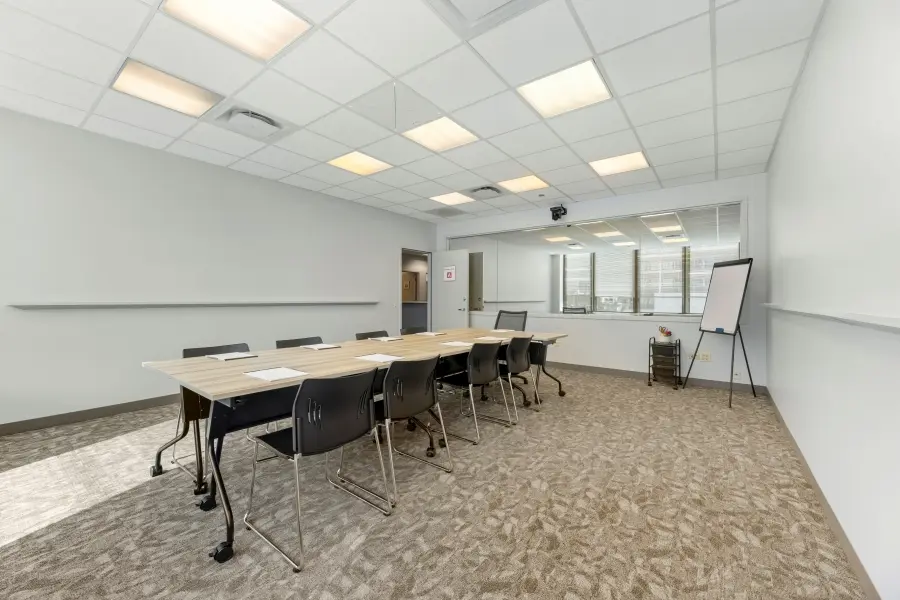 Traditional focus group room within the Wrigley Field suite at L&E Research Chicago, configured for standard participant panel discussions.