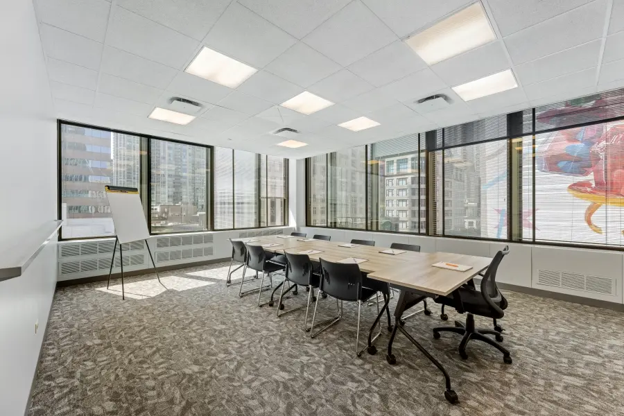 Millennium Park focus group room at L&E Research Chicago, showcasing modular tables configured in a hollow-square setup for consumer insight panels.