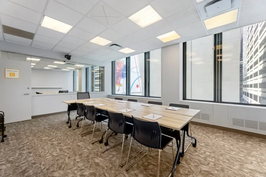 Large classroom-style focus group room rental within the O'Hare suite at L&E Research Chicago, configured as a mock jury room for sample jury studies.