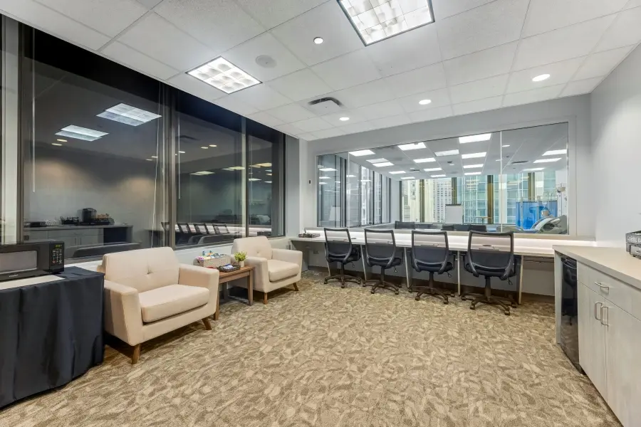 Comfortable executive client lounge for the Navy Pier suite at L&E Research Chicago, optimized for secure healthcare qualitative research monitoring.