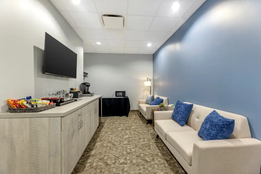 Wrigley Field client suite lounge at L&E Research Chicago, providing private workspaces and streaming feeds for remote or local research observers.