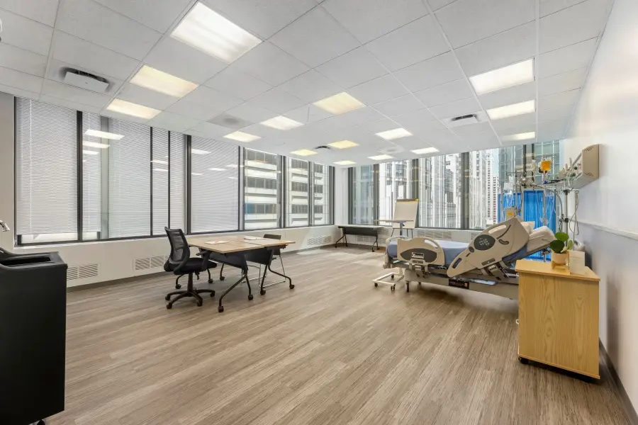 Advanced medical simulation suite at L&E Research Chicago on Michigan Avenue, configured as an authentic hospital room for healthcare research.