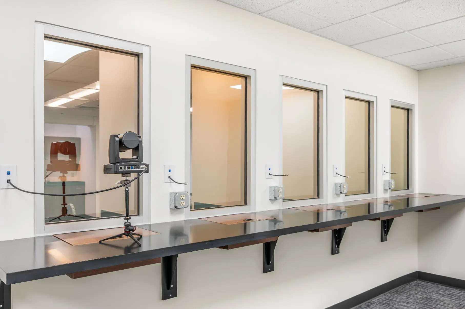 Multi-tier client observation gallery overlooking the high-capacity Queen City legal and focus group suite at L&E Research Cincinnati.