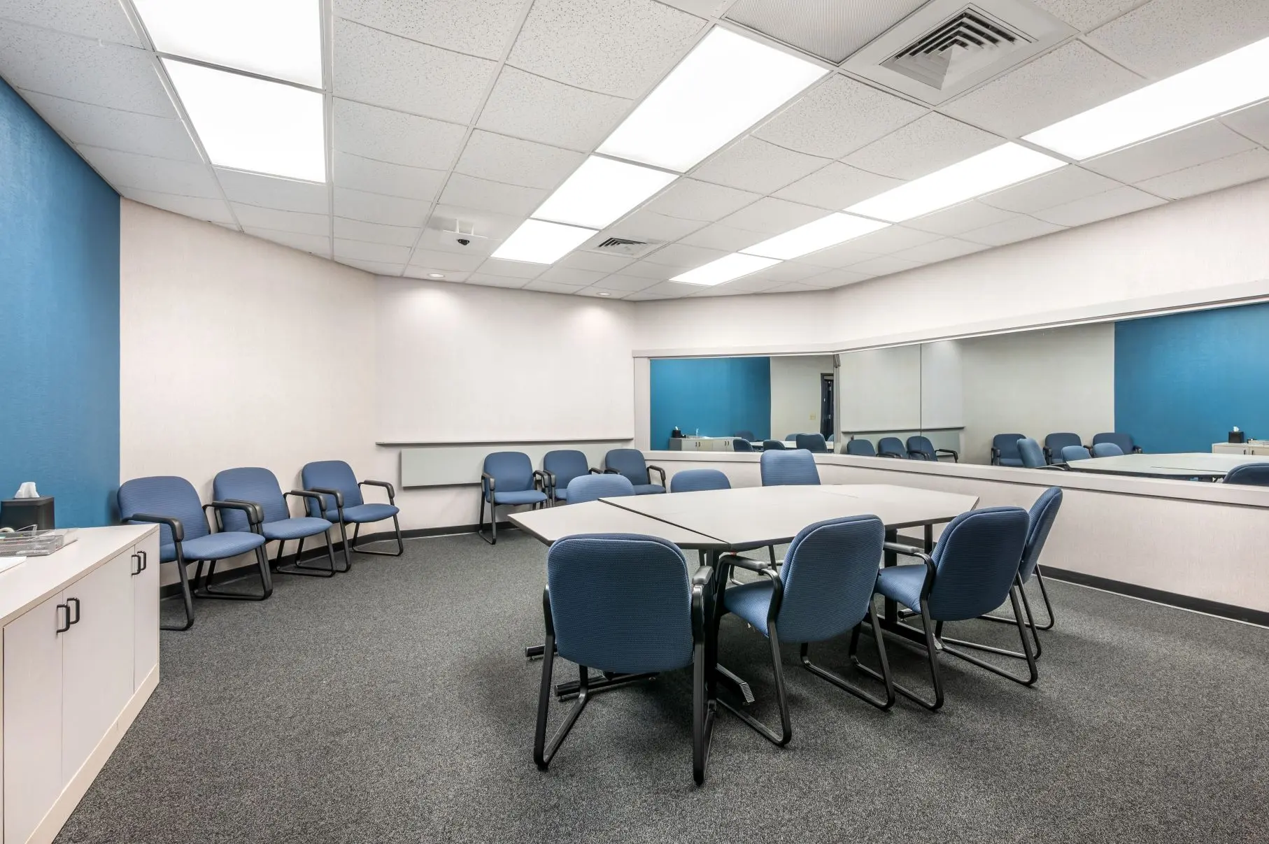 Versatile qualitative research space within the Music Hall suite at L&E Research Cincinnati, ideal for consumer testing and focus groups.