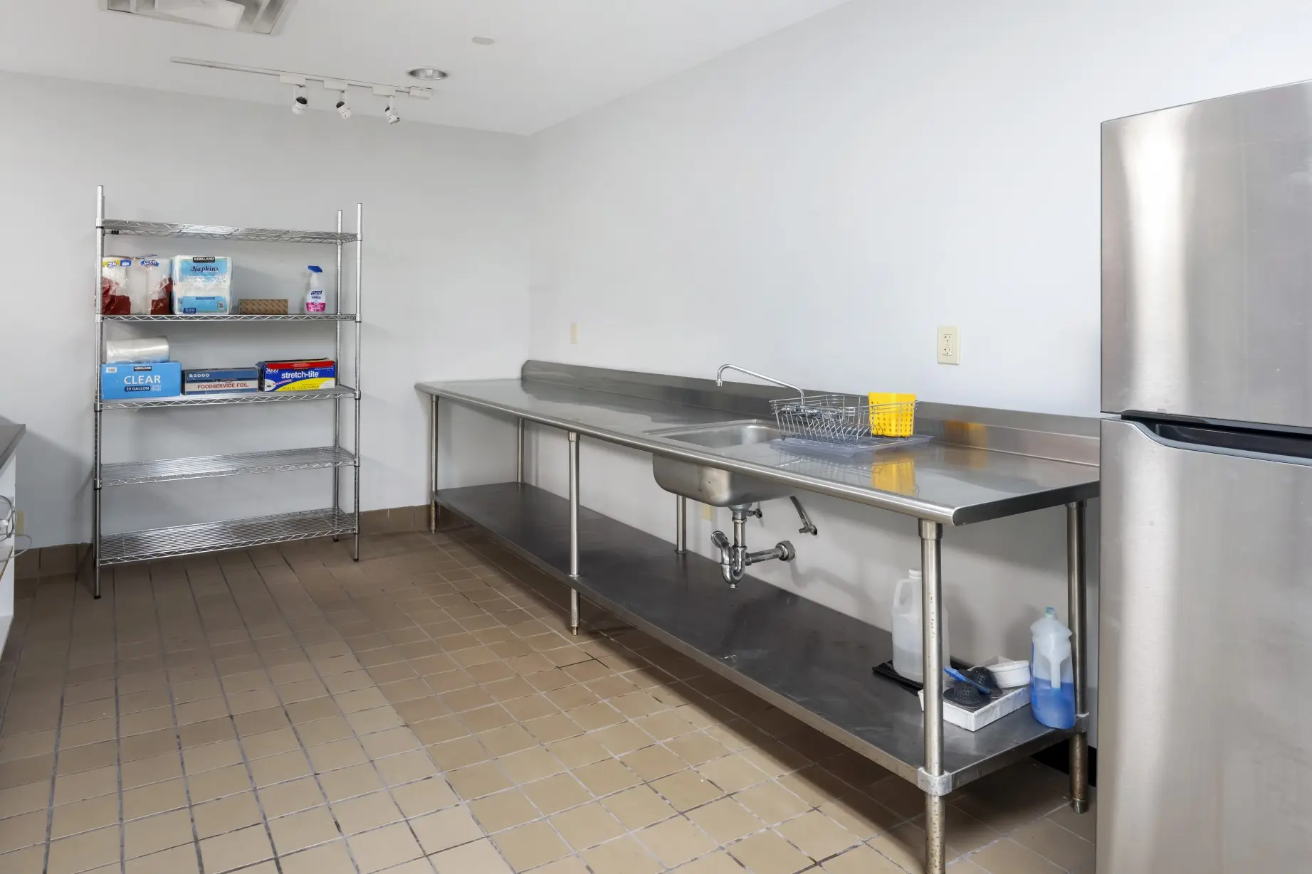 Stainless steel culinary preparation tables and workspace for food and beverage sensory research at L&E Research Columbus.