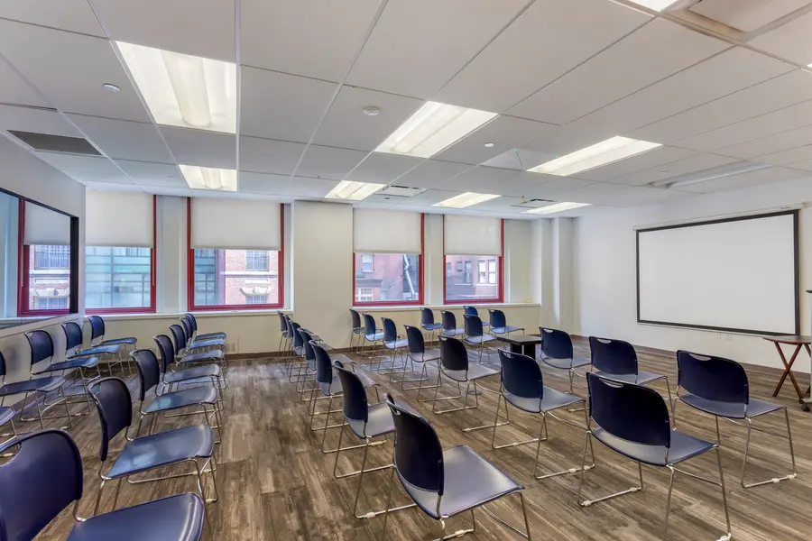 Spacious focus group room rental within the Landmark suite at L&E Research New York, featuring large windows overlooking Midtown Manhattan's Club Row.