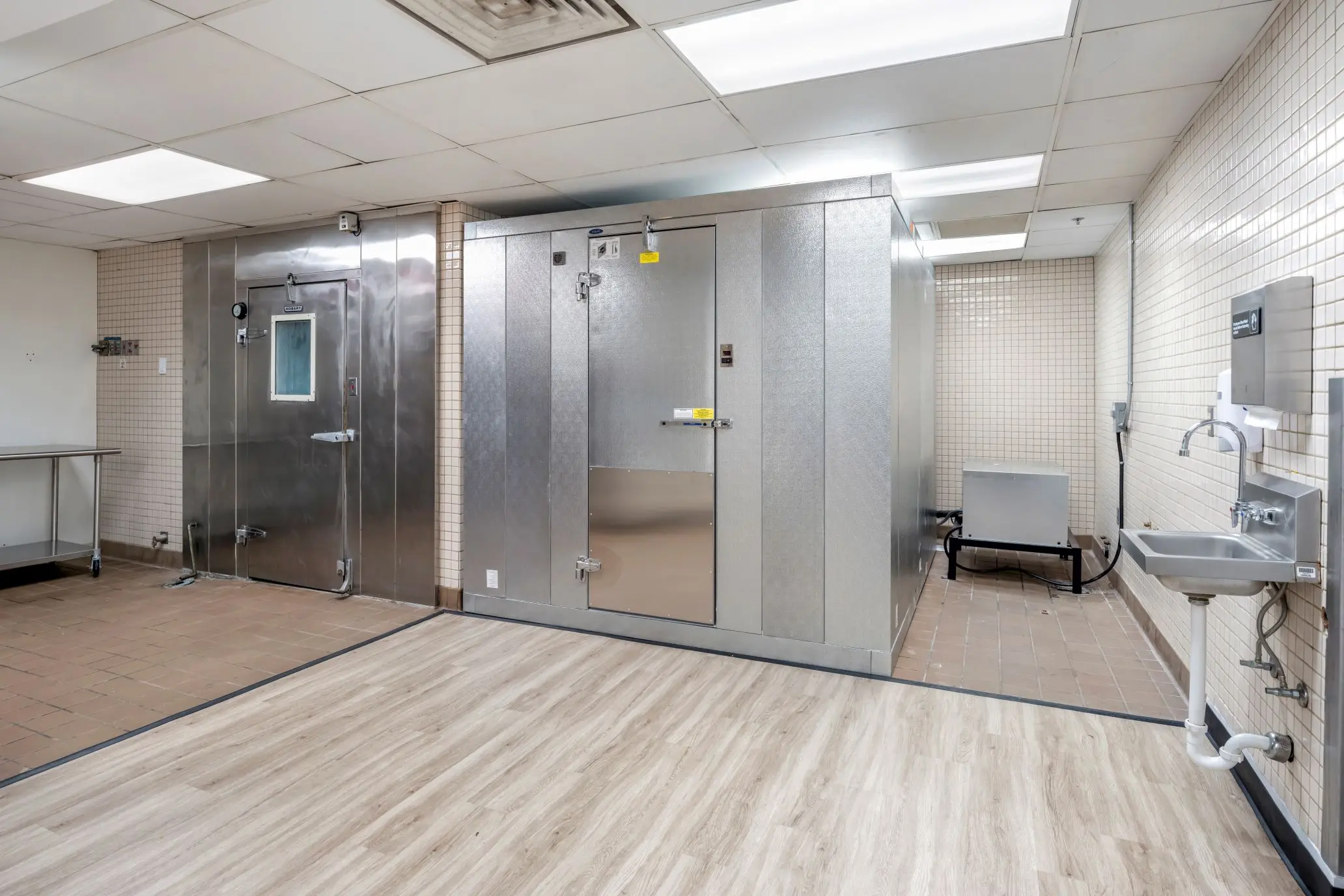 Advanced culinary cold storage zone at L&E Research Columbus, featuring walk-in cooler units for commercial food testing.