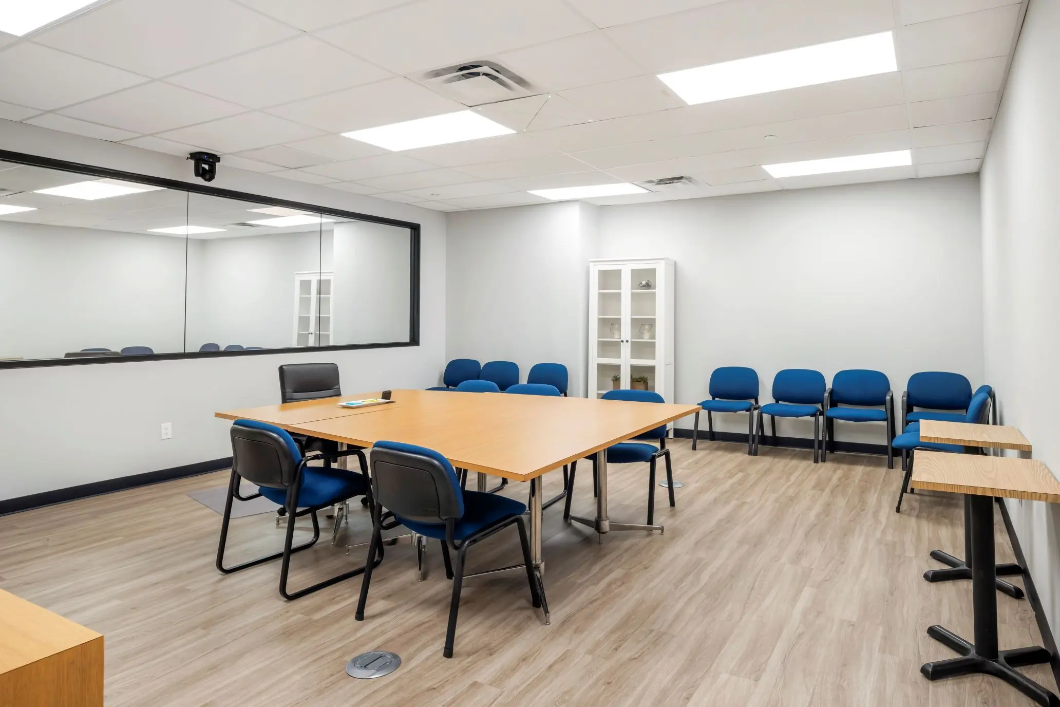 Traditional conference-style focus group room within the Capitol suite at L&E Research Columbus, set up for professional B2B panels.