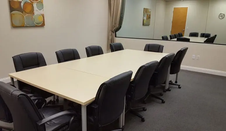 Spacious focus group room rental within the Manatee suite at L&E Research Orlando, featuring professional participant panel seating.