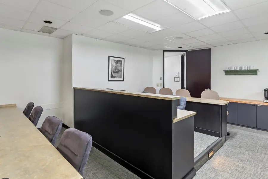 Alternative angle of the Biltmore client viewing room with tiered seating and professional workspaces at L&E Research Raleigh.