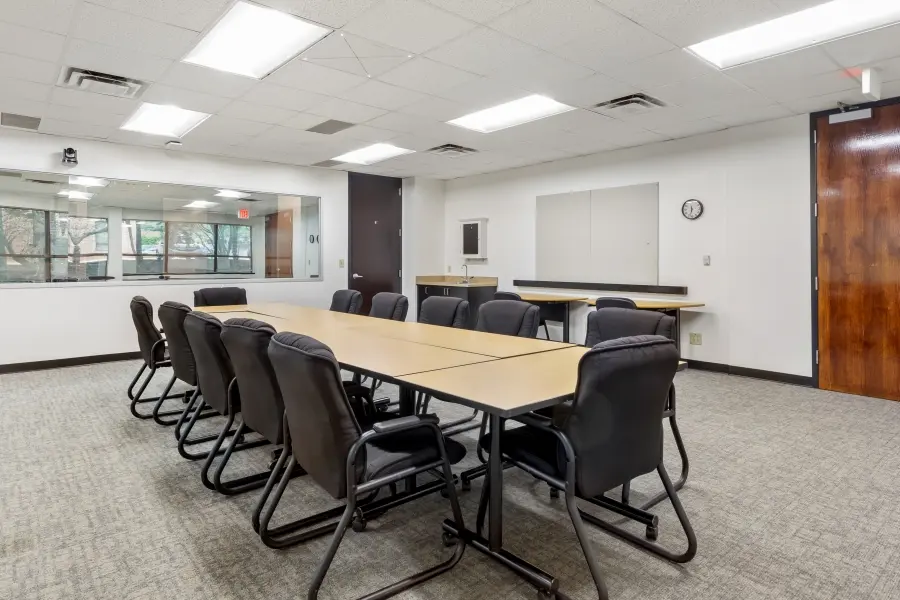 Versatile research room inside the Carolina suite at L&E Research Raleigh, set up for focus group discussions or consumer product handling.