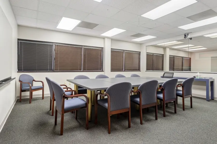 Flexible qualitative research space inside the St. Petersburg suite, featuring modular tables for customized consumer panel testing.