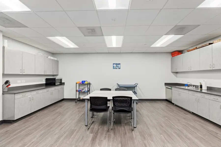 Alternative angle of the staff kitchen and catering coordination area supporting focus group operations at L&E Research Denver.