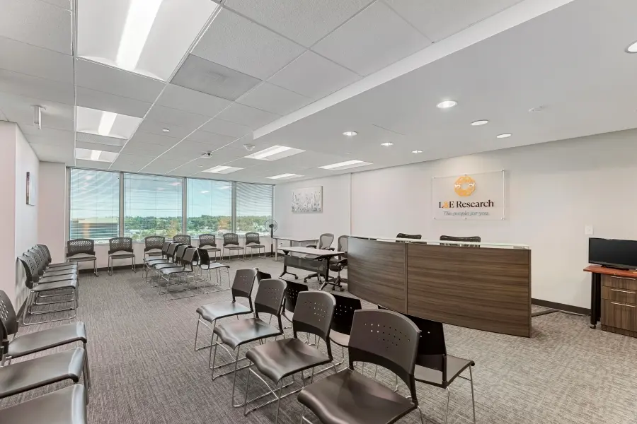 Participant waiting area with city views at the L&E Research Denver facility