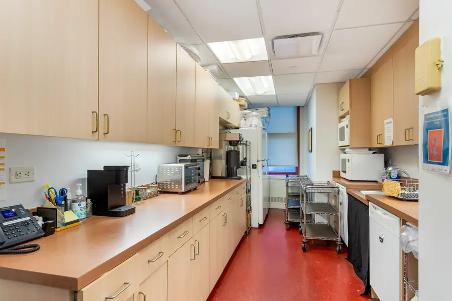Modern staff kitchen area supporting hospitality, catering, and operational flow at L&E Research's NYC office.