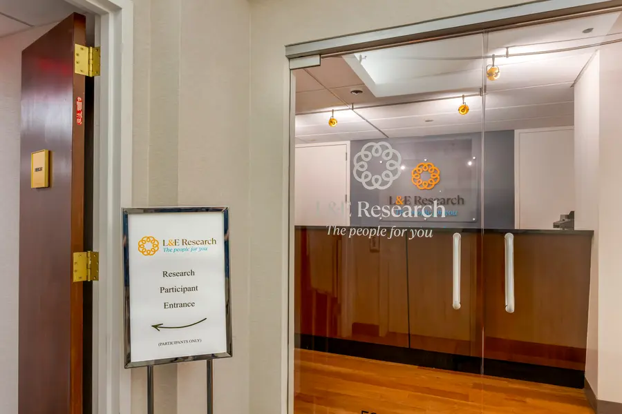 Interior lobby and check-in signage at the L&E Research New York City facility