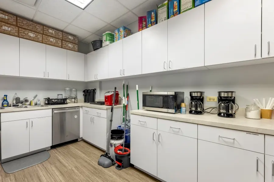 Clean hospitality and staff kitchen station facilitating research study logistics and operations at L&E Research Chicago.