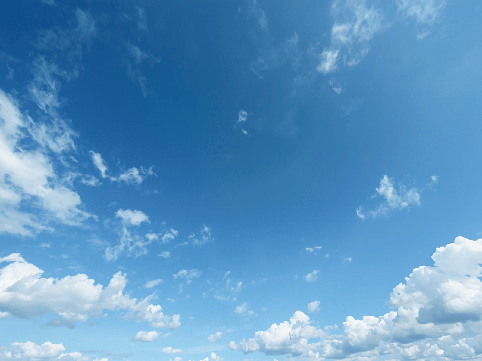 Clear blue sky with a few clouds