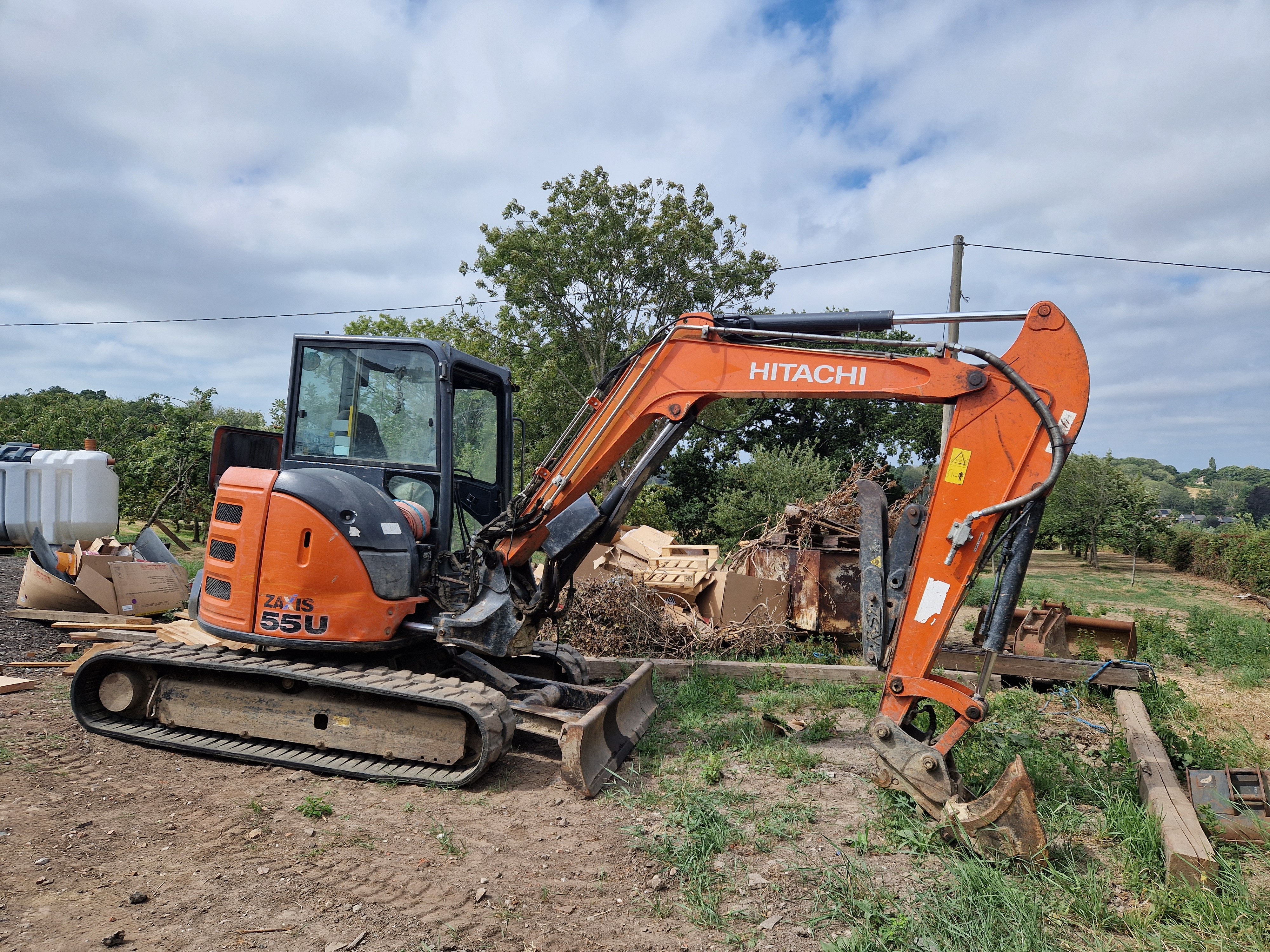 Shot of a black and orange hitachi digger.