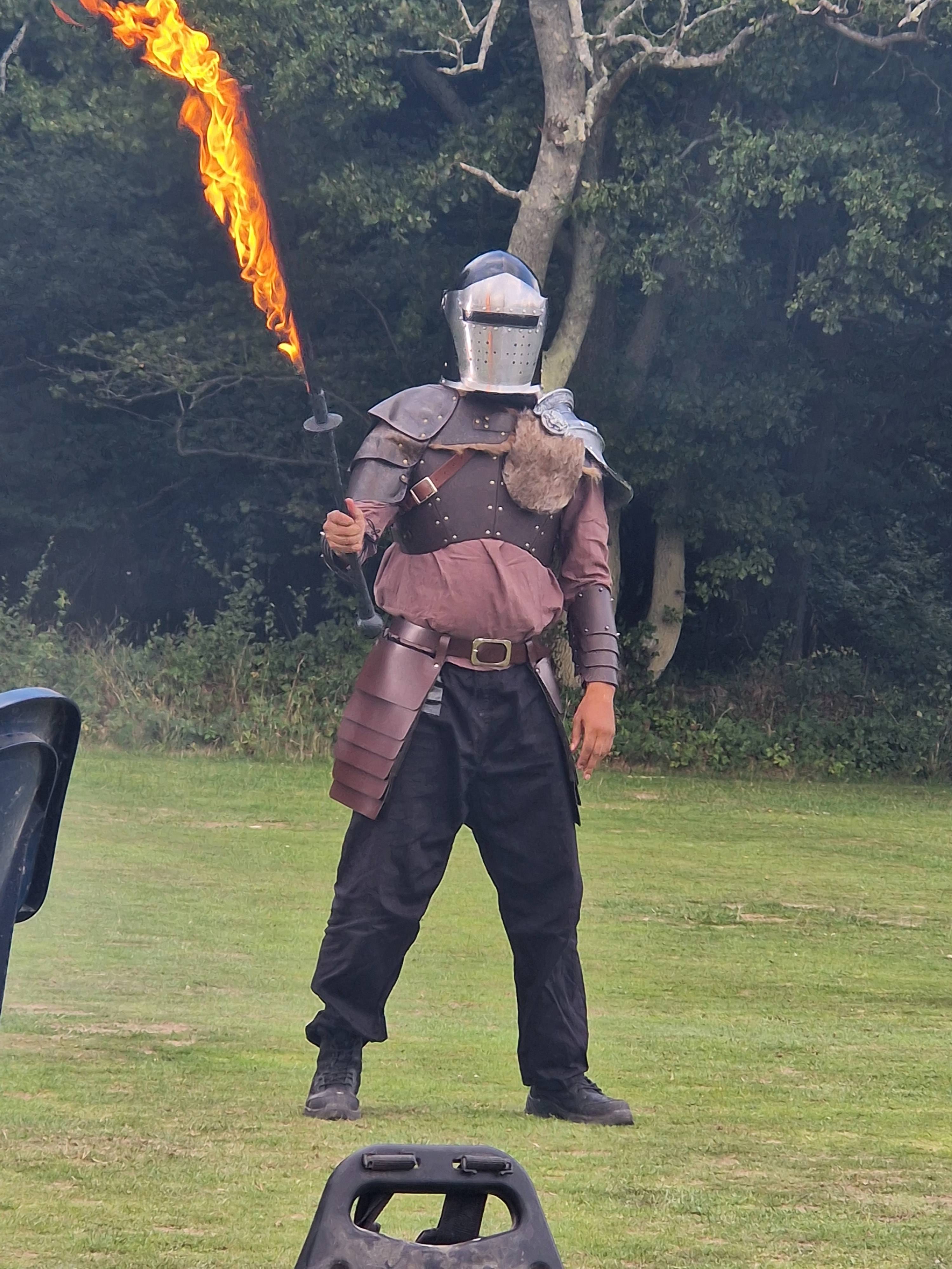 Shot of a knight with a flaming sword.