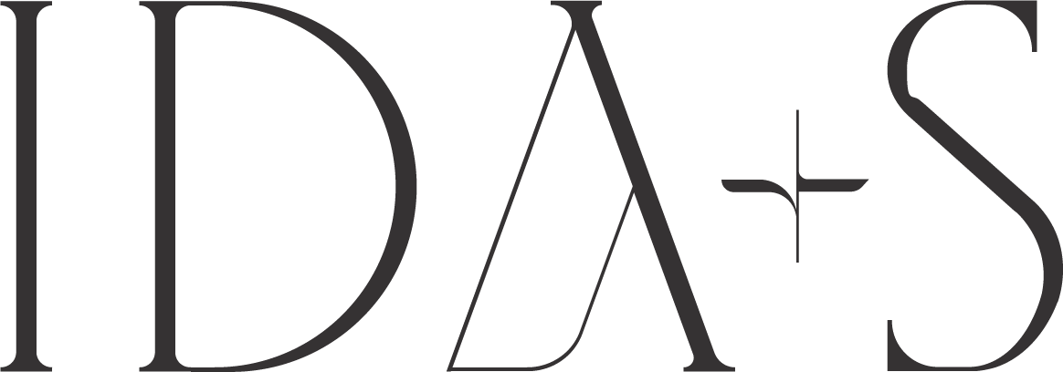 The stylized logo text reading IDAS in elegant, thin black letters.