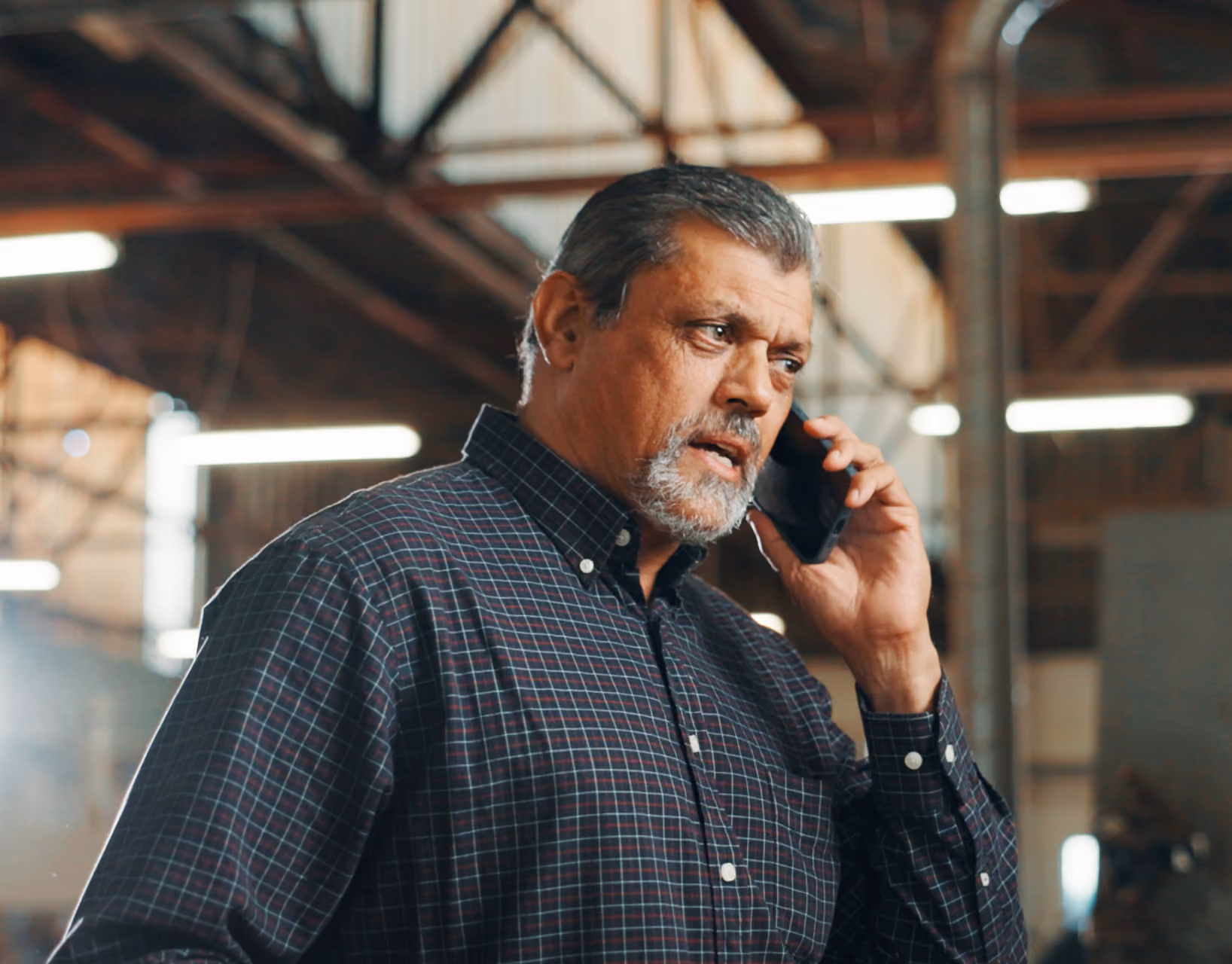 Man on a phone call in a warehouse