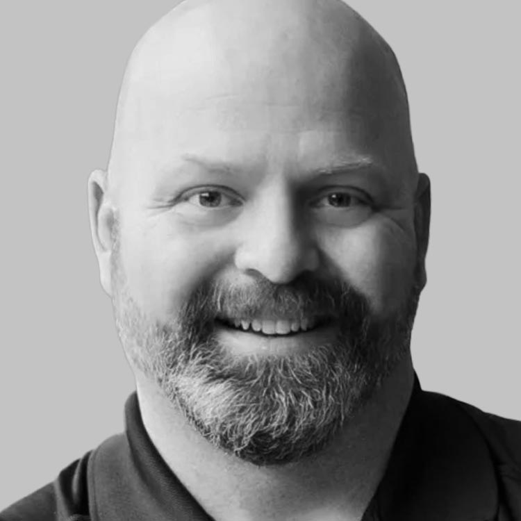 Headshot of Adam Nelson.