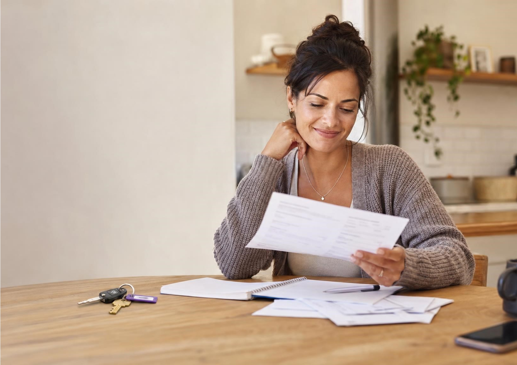 Women reviewing financial options and documents at a desk, representing bad credit mortgage advice and expert guidance