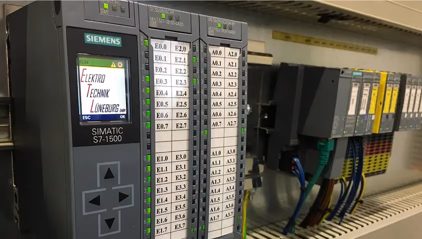 Siemens SIMATIC S7-1500 industrial control system with connected wiring in an electrical cabinet.