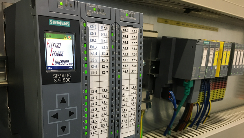Siemens SIMATIC S7-1500 industrial control system with connected wiring in an electrical cabinet.