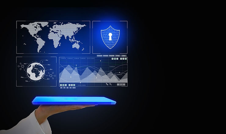 A hand holds a glowing blue tablet displaying digital screens: a world map, a shield icon, and data graphs, on a dark background.