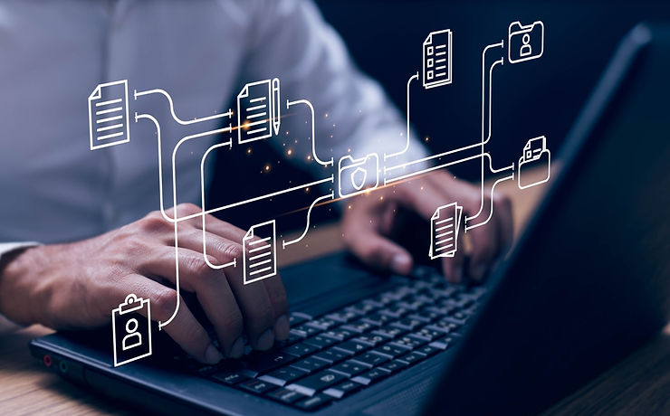 Hands typing on a laptop with digital icons of documents and folders floating above, symbolizing data management and connectivity.