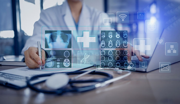 Doctor working on a laptop with digital medical icons, X-ray images, and a stethoscope on a desk, in a modern clinical setting.