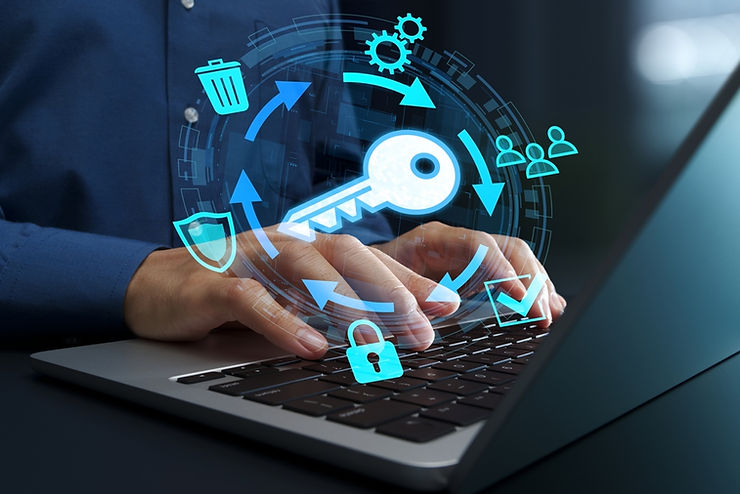 Hands typing on a laptop with holographic icons like a key, lock, and arrows, representing cybersecurity in a digital workspace.