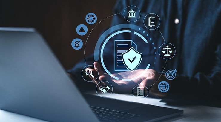 Hands hover over a laptop; digital icons like a shield and documents float above, suggesting cybersecurity. Dark background, blue tones.