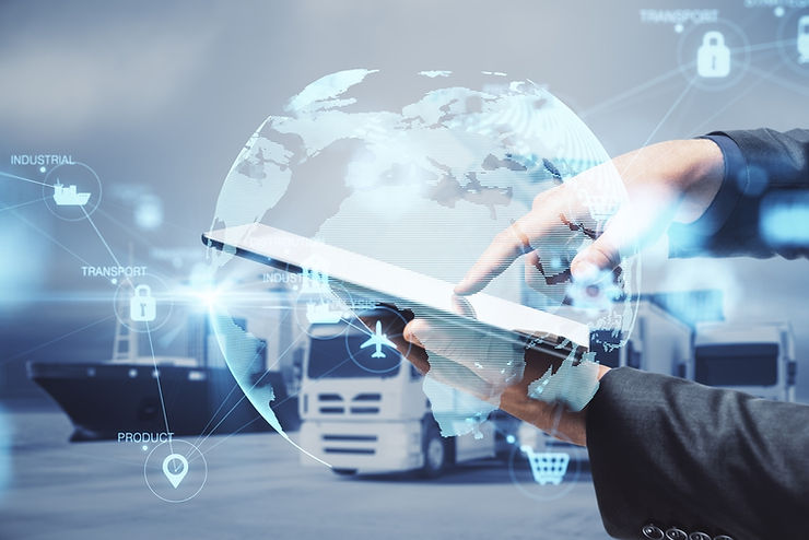 Hands using a tablet with a digital globe overlay, surrounded by transport icons. Background shows trucks, conveying a tech-driven logistics theme.