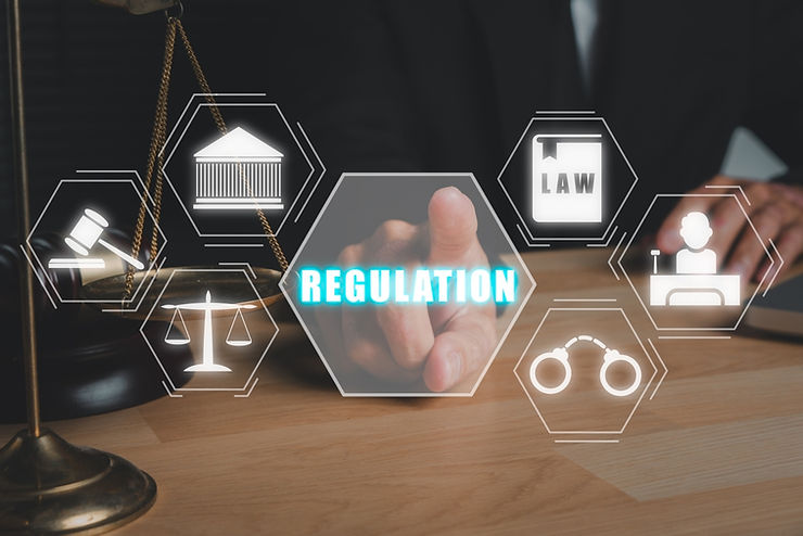 A person in a suit touches a virtual icon labeled "REGULATION" with legal symbols like scales and gavel on a wood desk background.