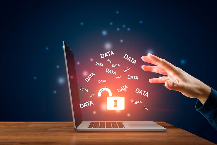 man in front of a laptop with unlock data icon