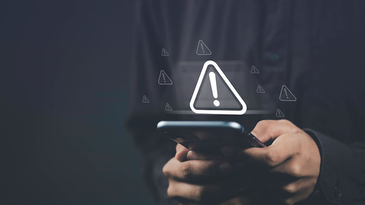man holding a phone with big floating exclamation point