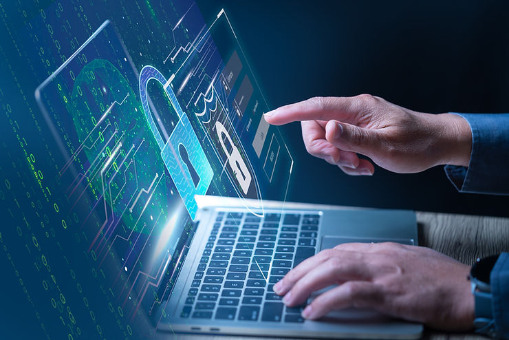 man pointing to the laptop typing in his passcode