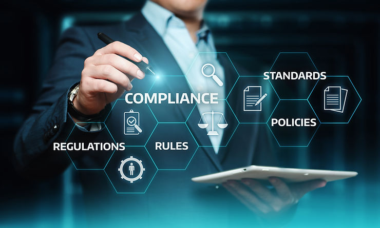man holding a pen and ipad with compliance and regulations documents