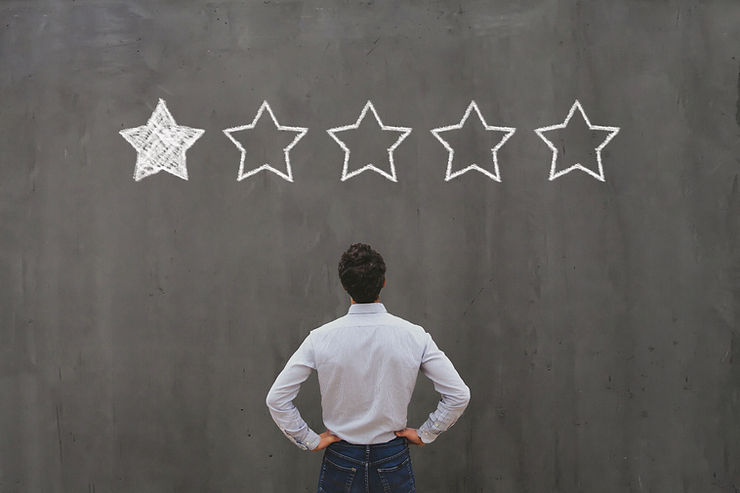 man looking on the wall with 1 star rating