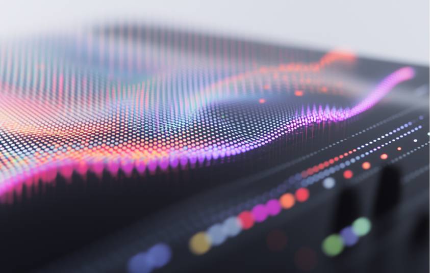 Abstract digital waves composed of colorful glowing dots forming a flowing, grid-like surface.