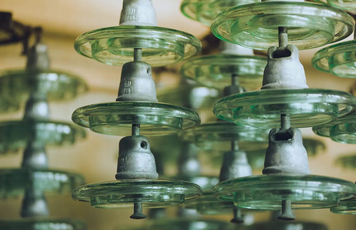 Export packaging and logistics of high-voltage glass insulators prepared for international shipment.