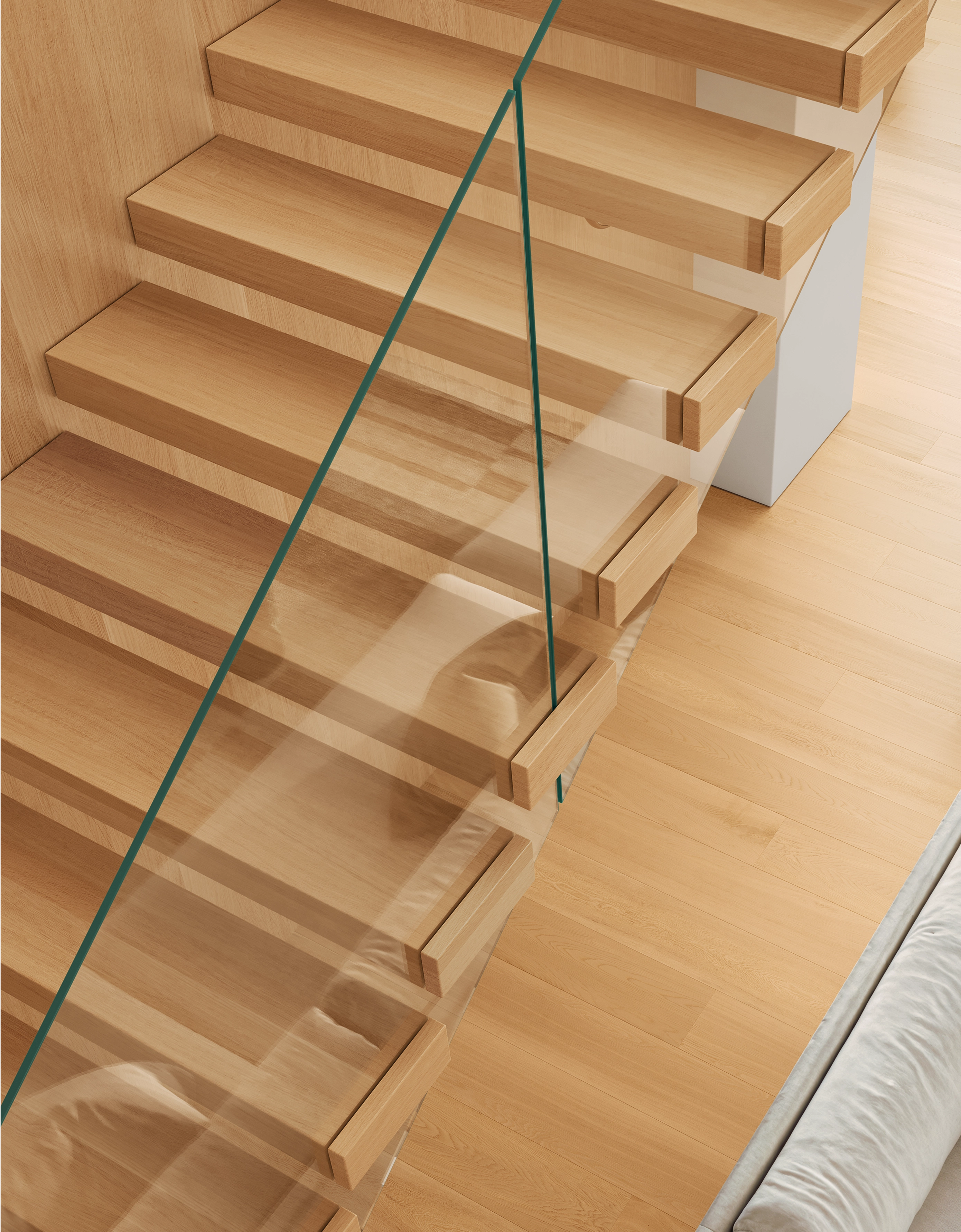 Modern wooden staircase with floating steps and a transparent glass railing next to light hardwood floor.