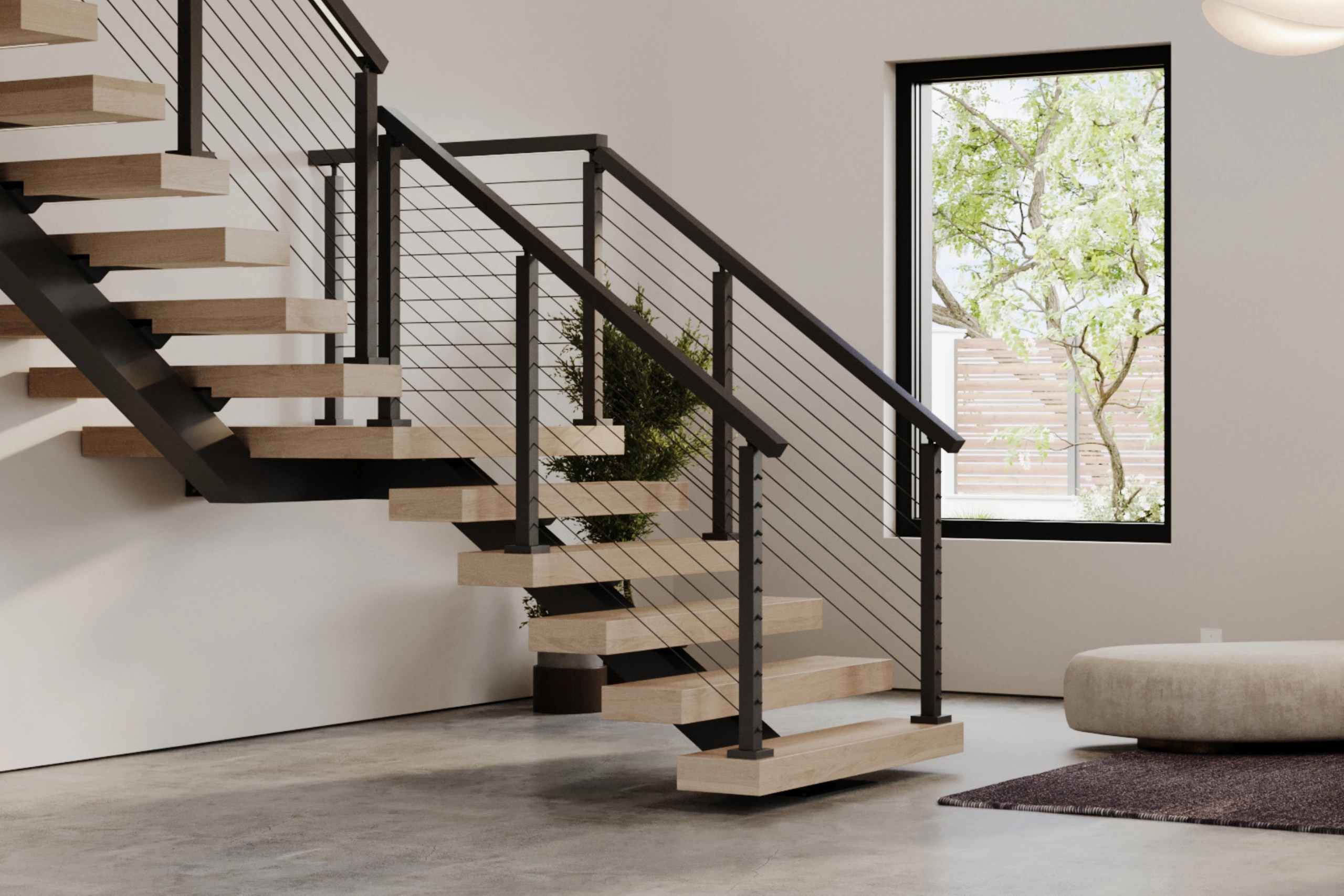 Modern floating staircase with black metal railings in a bright room with a window and plant.
