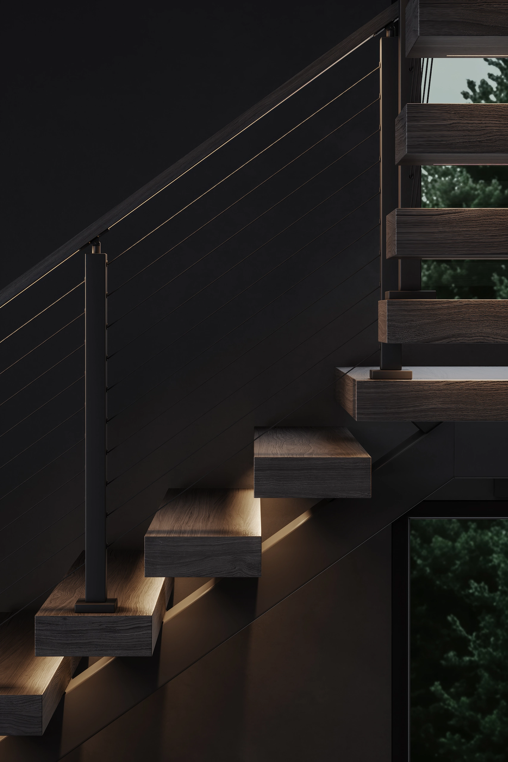FLIGHT Mono floating stairs with under-step ambient lighting and black metal cable railing with integrated LED handrail lighting inside a dark room with a window showing green tree foliage outside.